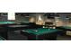 Billiard room with multiple pool tables under pendant lights, perfect for game nights at 11917 Bayonet Ln # 11917, New Port Richey, FL 34654