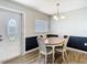 Cozy dining room with hardwood floors, chair railing, and a chandelier at 11917 Bayonet Ln # 11917, New Port Richey, FL 34654