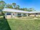 Charming one-story home with green lawn, a walkway, and basic landscaping at 11917 Bayonet Ln # 11917, New Port Richey, FL 34654