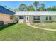 Well-maintained one-story home with lush green lawn and basic landscaping at 11917 Bayonet Ln # 11917, New Port Richey, FL 34654