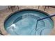 Relaxing round hot tub with a safety handrail, great for unwinding after a long day at 11917 Bayonet Ln # 11917, New Port Richey, FL 34654