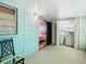 Enclosed lanai featuring a laundry area and sliding glass door to the bedroom at 11917 Bayonet Ln # 11917, New Port Richey, FL 34654