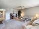 Comfortable living room featuring neutral walls, carpeted floors, and access to other rooms at 11917 Bayonet Ln # 11917, New Port Richey, FL 34654