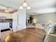 Cozy living room connected to an open-concept kitchen and dining area, featuring plush furniture at 11917 Bayonet Ln # 11917, New Port Richey, FL 34654