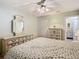 A main bedroom features dressers with mirrors and closet access for a luxurious retreat at 11917 Bayonet Ln # 11917, New Port Richey, FL 34654