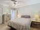 A main bedroom features ample storage with a dresser, closet access and side tables at 11917 Bayonet Ln # 11917, New Port Richey, FL 34654