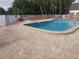 Community pool area with lounge chairs, offering a refreshing outdoor experience at 11917 Bayonet Ln # 11917, New Port Richey, FL 34654