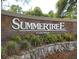 Community sign for SUMMERTREE, an age and deed-restricted community at 11917 Bayonet Ln # 11917, New Port Richey, FL 34654