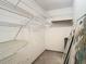 Walk-in closet with multiple levels of shelving to maximize storage capabilities at 11917 Bayonet Ln # 11917, New Port Richey, FL 34654