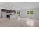 Modern kitchen featuring stainless steel appliances, dark wood cabinetry, and a center island with seating at 13066 Nusser Ave, Weeki Wachee, FL 34614