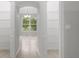 A look into the pantry, showcasing shelving and tiled floors, accessed via an arched doorway at 13066 Nusser Ave, Weeki Wachee, FL 34614