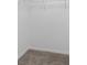 Spacious walk-in closet featuring plush carpeting and neutral walls at 13066 Nusser Ave, Weeki Wachee, FL 34614