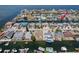 Aerial view of a waterfront community with canals, docks, and homes with pools at 13610 Claudia Dr, Hudson, FL 34667
