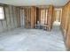 Open living area showcasing framing ready for your personalized design at 13610 Claudia Dr, Hudson, FL 34667