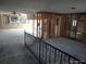 Open living area showcasing framing, ceiling fan, and natural light from multiple windows at 13610 Claudia Dr, Hudson, FL 34667