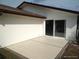 Concrete patio with sliding glass door offers access to the outside living space at 13610 Claudia Dr, Hudson, FL 34667