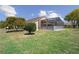 Expansive backyard features a screened-in pool area, offering a private oasis for outdoor enjoyment and relaxation at 13643 Pimberton Dr, Hudson, FL 34669