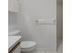 Bathroom featuring a toilet, towel rack, and tiled shower stall at 13643 Pimberton Dr, Hudson, FL 34669