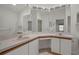 Bathroom vanity with double sinks, a makeup counter, and bright lighting at 13643 Pimberton Dr, Hudson, FL 34669