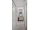 Bathroom view featuring a vanity with a mirror and tile flooring at 13643 Pimberton Dr, Hudson, FL 34669