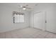 Bright and spacious bedroom with ceiling fan and an attached closet and door at 13643 Pimberton Dr, Hudson, FL 34669