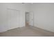 Spacious bedroom featuring neutral carpet and closet at 13643 Pimberton Dr, Hudson, FL 34669