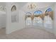 Bright dining room with large windows and chandelier lighting at 13643 Pimberton Dr, Hudson, FL 34669