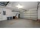 Spacious garage with epoxy floors and an automatic garage door at 13643 Pimberton Dr, Hudson, FL 34669