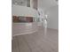 Open floor plan featuring a kitchen with a breakfast bar and tile floors at 13643 Pimberton Dr, Hudson, FL 34669