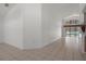 Bright and airy living room with tile floors, high ceilings, and access to the outdoor pool area at 13643 Pimberton Dr, Hudson, FL 34669