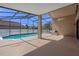 Screened-in pool with spacious patio area, perfect for outdoor enjoyment at 13643 Pimberton Dr, Hudson, FL 34669
