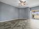 Bright, open living area featuring ceramic flooring and sliding glass doors to the back yard at 14474 Arborglades Dr, Spring Hill, FL 34609