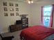 Cozy bedroom featuring a decorative display shelf and katana swords, offering a unique and personalized touch at 18336 Macek Rd, Weeki Wachee, FL 34614