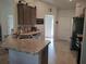 Eat in kitchen featuring granite countertops and stainless steel appliances at 18336 Macek Rd, Weeki Wachee, FL 34614