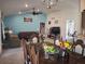 Open concept living/dining room featuring vaulted ceilings and neutral colors at 18336 Macek Rd, Weeki Wachee, FL 34614