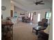 Inviting open-concept living and dining area with tile flooring and modern furnishings at 18336 Macek Rd, Weeki Wachee, FL 34614