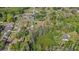 Wide aerial view of a residential area with established homes and mature trees, showcasing the neighborhood layout at 19019 3Rd Ne St, Lutz, FL 33549