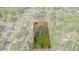 Aerial view of a property with a large wooded lot and a home at 19019 3Rd Ne St, Lutz, FL 33549