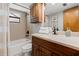 Traditional bathroom featuring a tub with a shower and a vanity with a light countertop at 19019 3Rd Ne St, Lutz, FL 33549