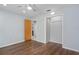 Bedroom featuring wood floors, light-colored walls, and a closet at 19019 3Rd Ne St, Lutz, FL 33549