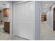 Hallway with linen closet and view of bathroom at 19019 3Rd Ne St, Lutz, FL 33549