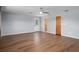 Spacious living room featuring laminate floors, light-colored walls, and neutral decor at 19019 3Rd Ne St, Lutz, FL 33549