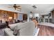 Open-concept living room showcasing wood accents, comfortable seating, and a view into the kitchen at 19019 3Rd Ne St, Lutz, FL 33549