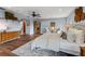 Expansive main bedroom featuring wood floors, neutral walls, sitting area and ceiling fan at 19019 3Rd Ne St, Lutz, FL 33549