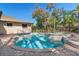 Inviting backyard pool and spa area with a brick paver patio, and black fence provide tranquil relaxation at 19019 3Rd Ne St, Lutz, FL 33549
