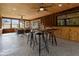 Relaxing screened-in porch with wood-paneled ceiling, ceiling fans, and dining table at 19019 3Rd Ne St, Lutz, FL 33549