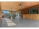 Screened-in porch with ceiling fans and exterior bar area at 19019 3Rd Ne St, Lutz, FL 33549