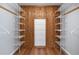Walk-in closet featuring ample shelving and closet space at 19019 3Rd Ne St, Lutz, FL 33549