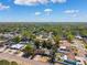 An aerial view showcases the property and surrounding neighborhood at 2608 W Fletcher Ave, Tampa, FL 33618