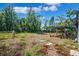 Backyard shows a deck and ample space, offering potential for customization and outdoor activities at 2608 W Fletcher Ave, Tampa, FL 33618